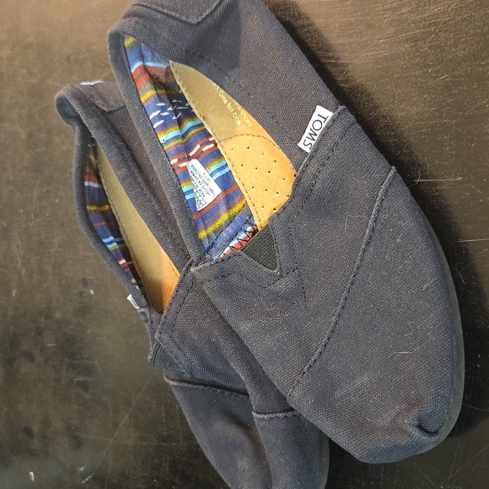 Tom's black flats